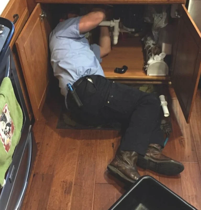 Plumber under kitchen in Carlsbad, CA